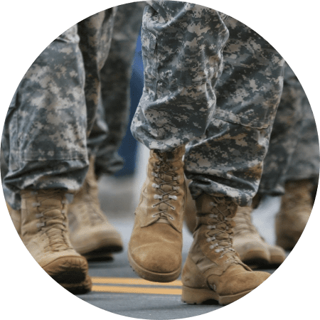 A close up of military boots on soldiers